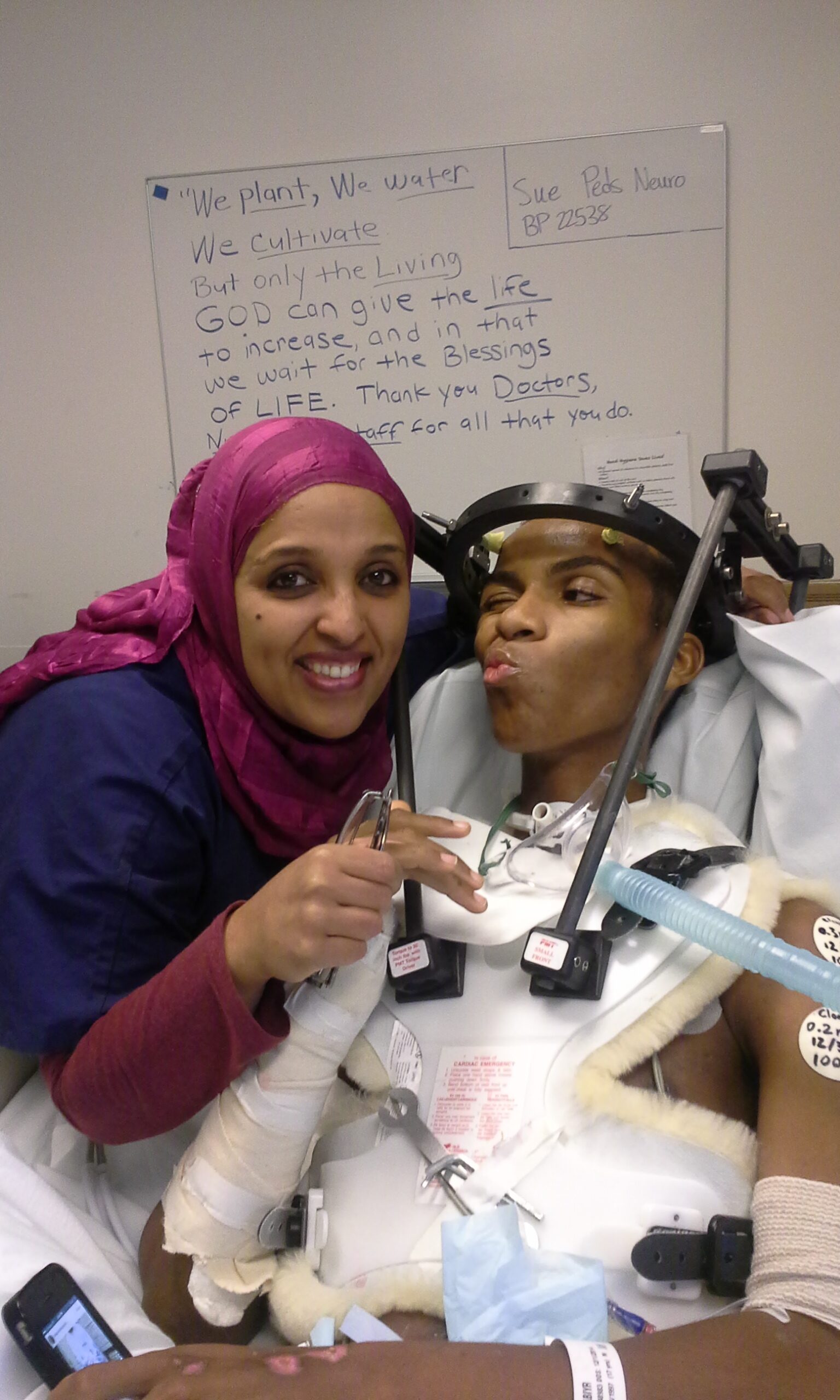 Big smiles with Abyir’s favorite female Nurse and the Mother’s written quote on the board in the back ground. ~Complete quote inside of the book~